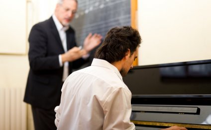 Instructor Giving Man Piano