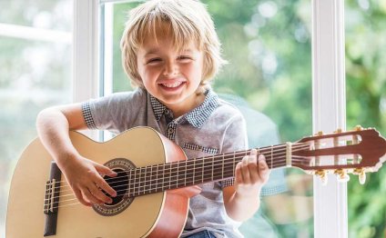 A young kid learning to play